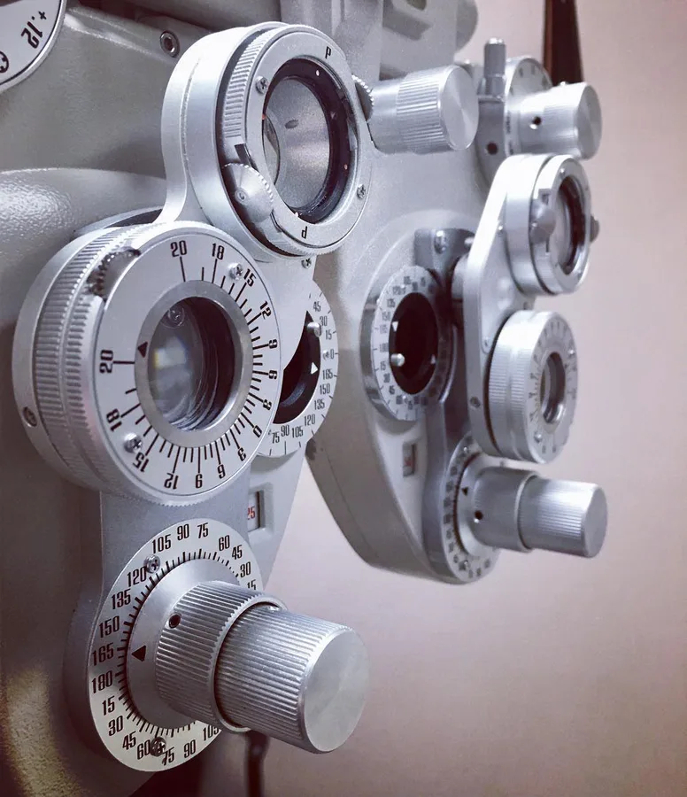 The lens dials of a phoropter, the instrument an optometrist uses to measure how well each eye sees