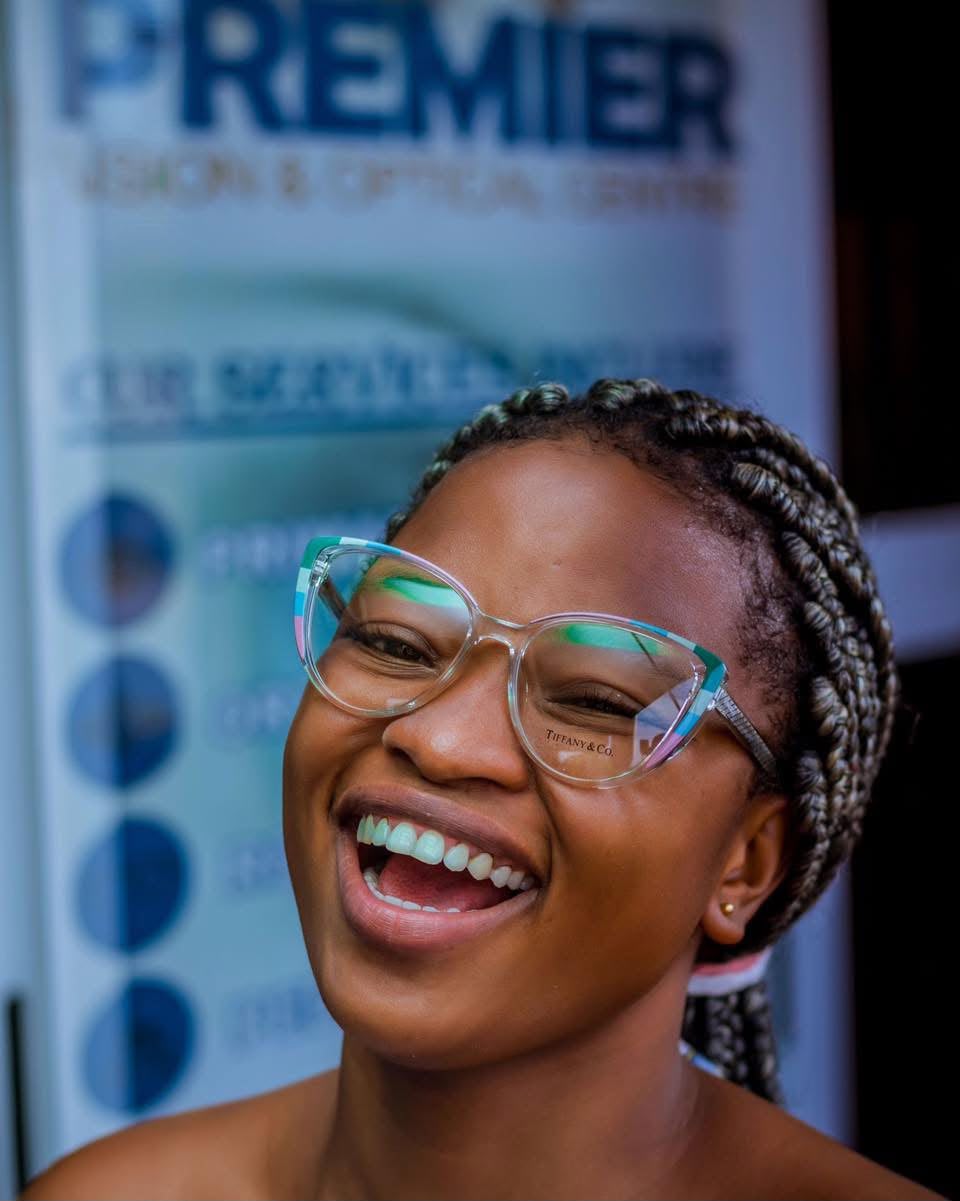 A smiling patient wearing her new glasses at Premier Vision Eye Care